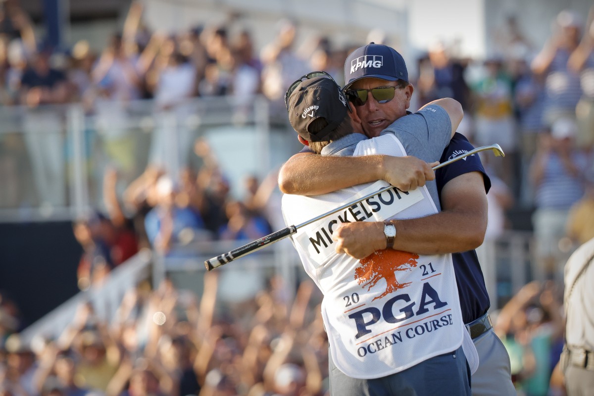 Brotherly love: Phil Mickelson wins the PGA Championship with brother Tim on the bag