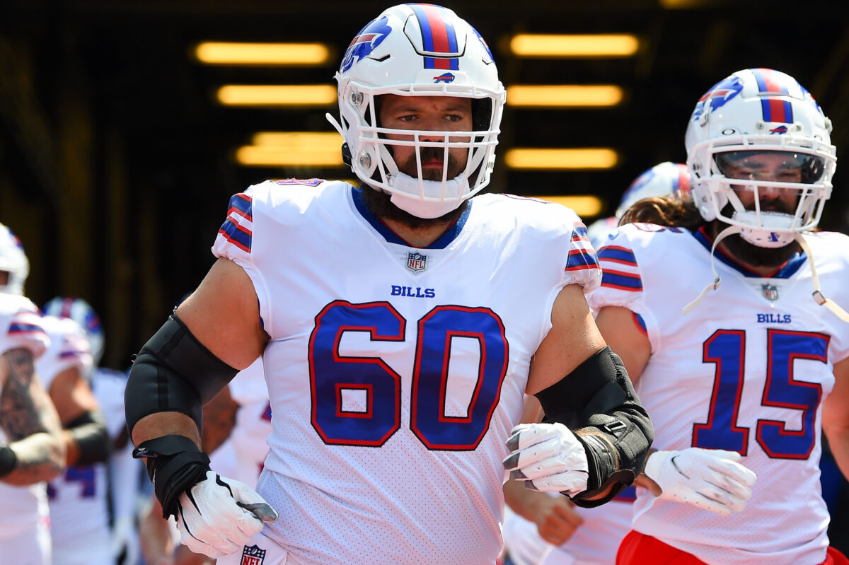 Bills’ Mitch Morse gives encouragement to Patriots’ rookie Christian Barmore