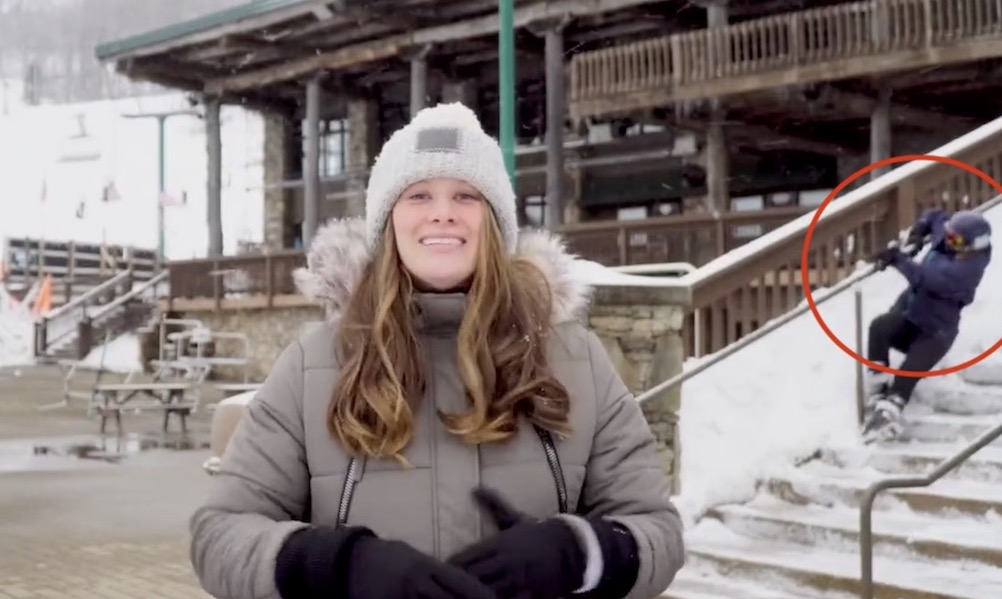 Watch: Snow reporter photobombed by very clumsy skier