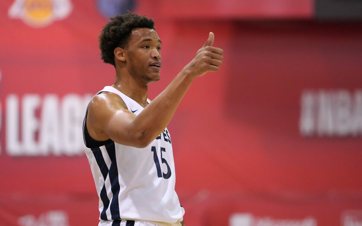 Wendell Moore gifted his shoes to a young fan at Twin Cities Pro-Am