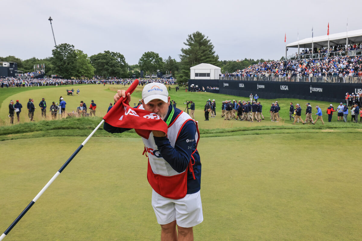 Photos: Caddies and their flags from the 18th hole after winning a tournament