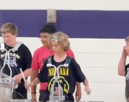 Watch this talented high school drummer literally spin it for the audience