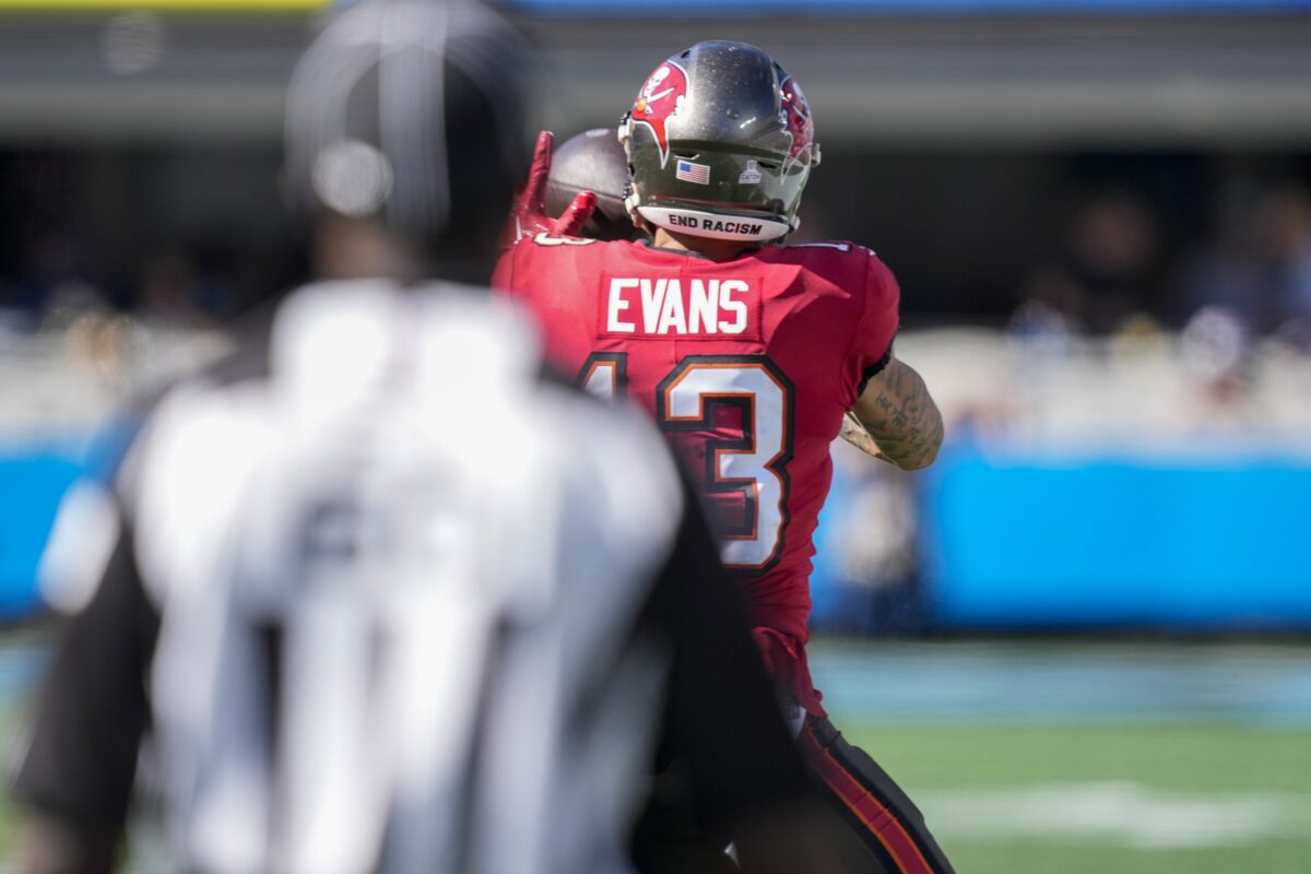 Was Tampa Bay wide receiver Mike Evans chatting an official over golf lessons? One insider says so