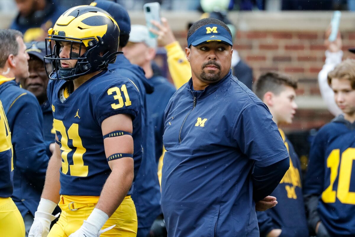 Michigan running backs coach Mike Hart carted off after collapsing on sidelines