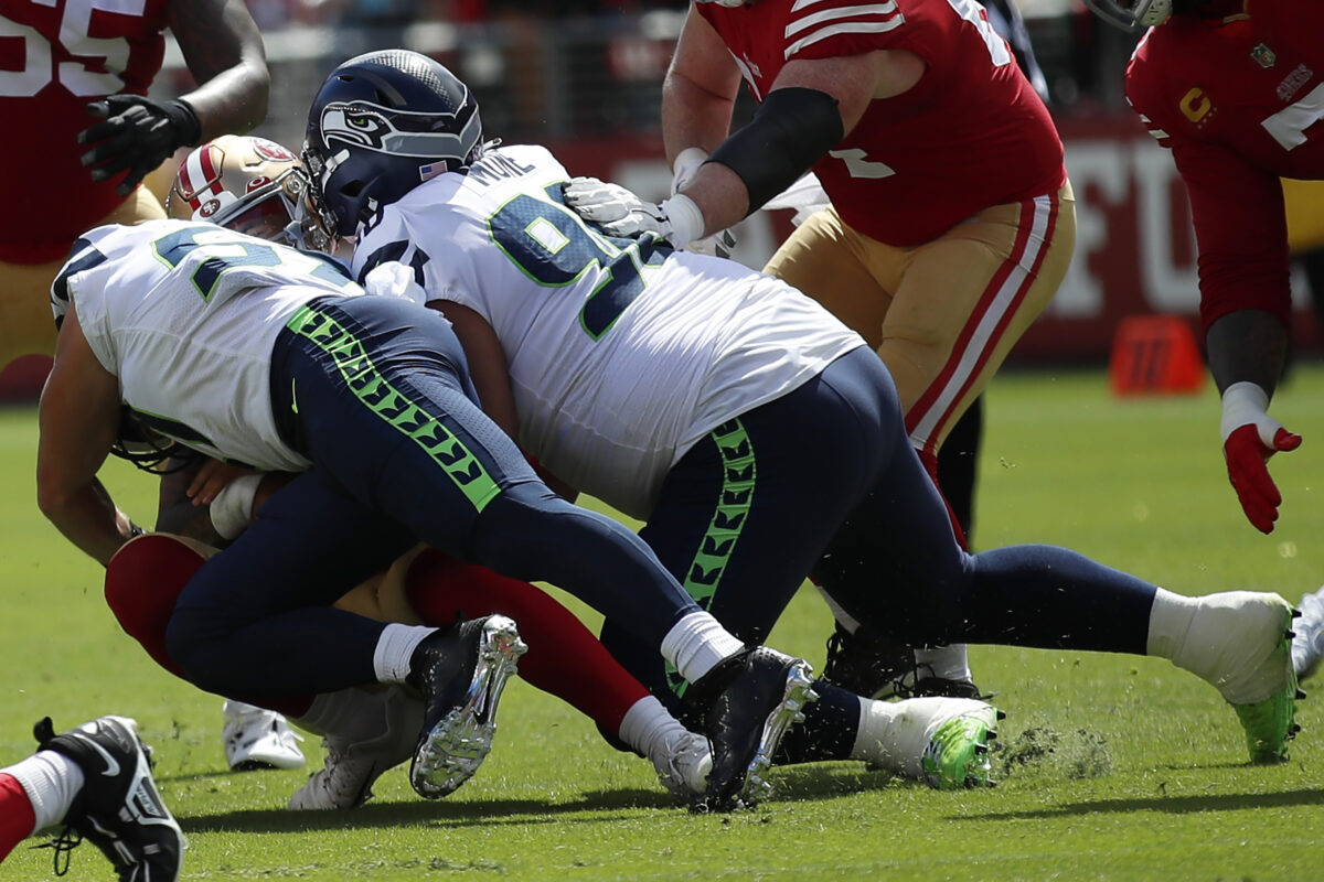 Seahawks DT Bryan Mone carried off the field, ruled out vs. 49ers