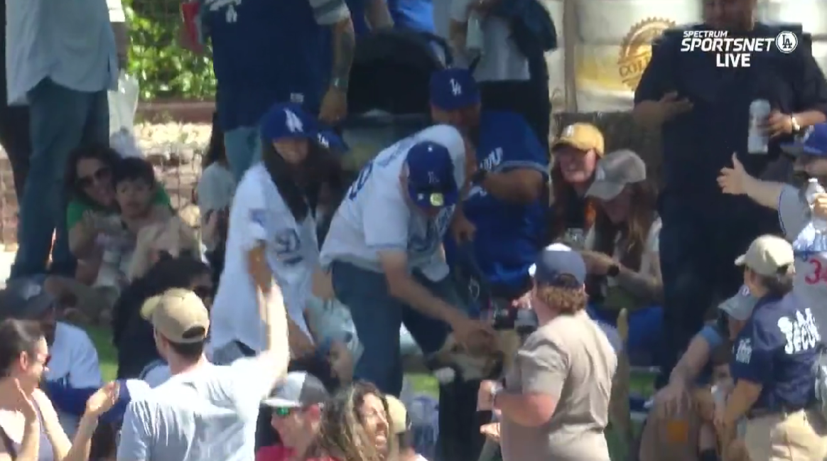 A very good dog caught a home run ball at a Dodgers spring training game