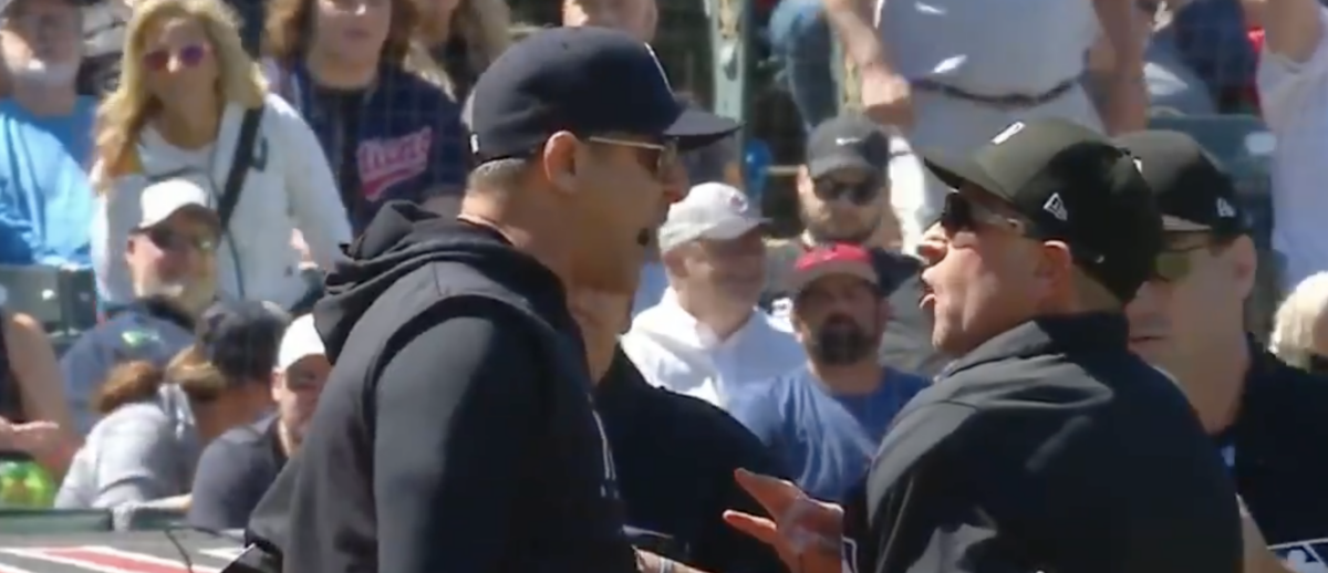 A furious Aaron Boone was ejected after umpires appeared to reverse a call without Guardians challenge