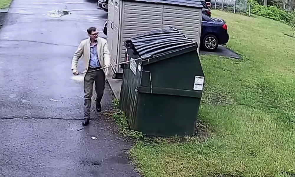 Watch: Man unlocking dumpster gets the shock of his life