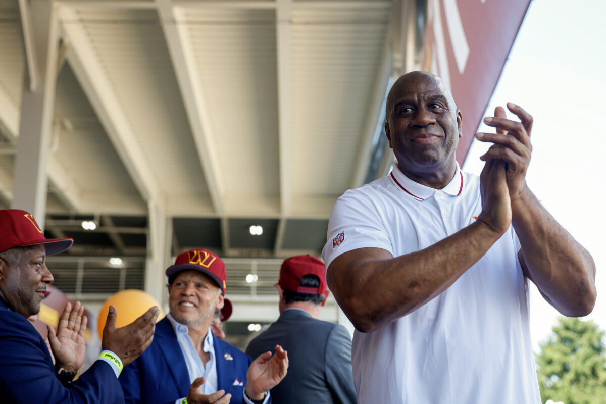 LOOK: Magic Johnson and his entire family rocking Commanders’ gear on vacation