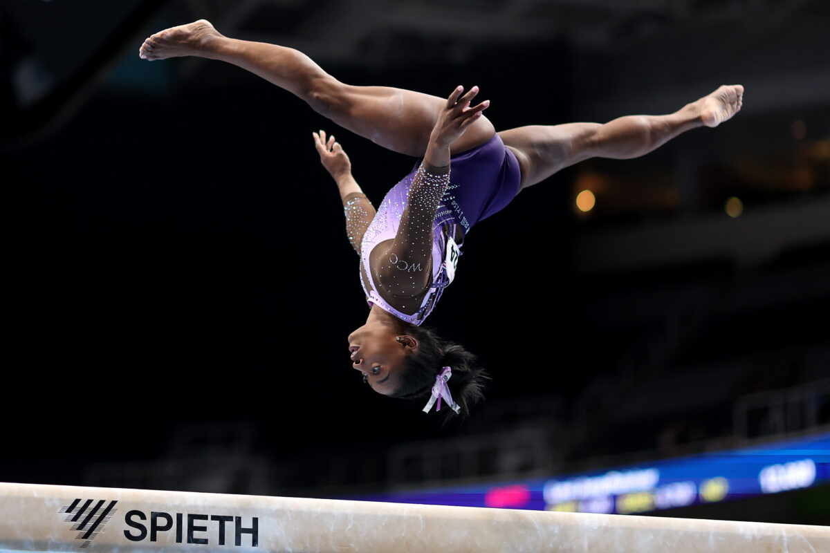 The great Simone Biles beams during gymnastics comeback