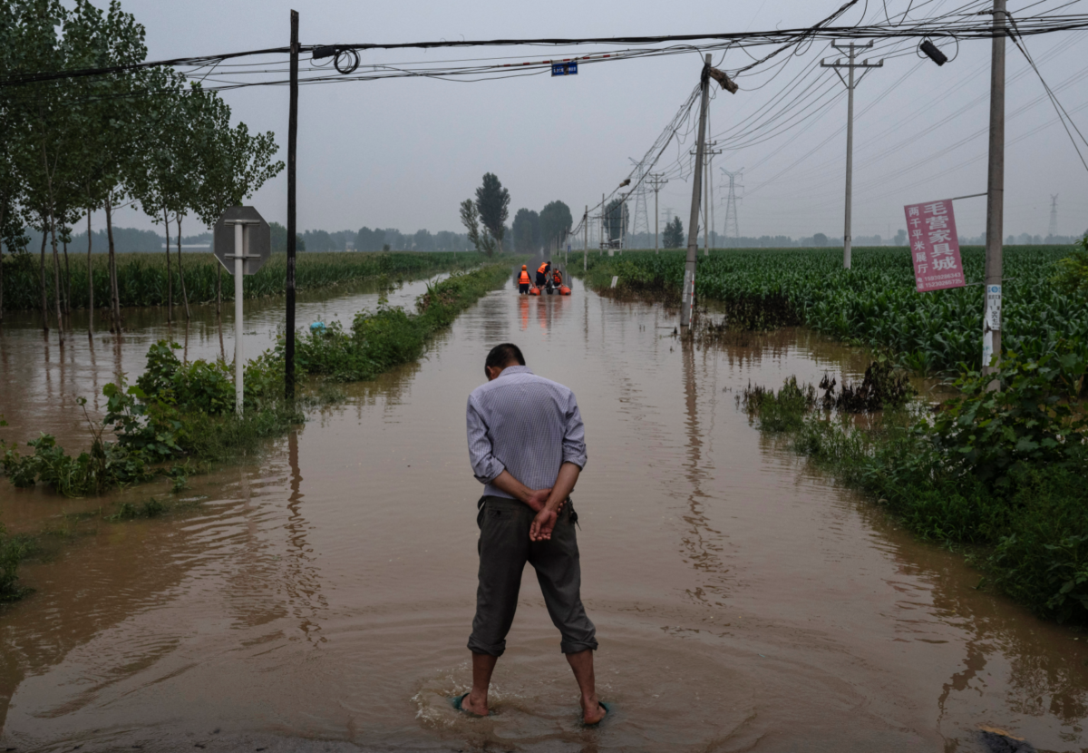 Harrowing scenes from flooding in China after heaviest rainfall Beijing has experienced in 140 years