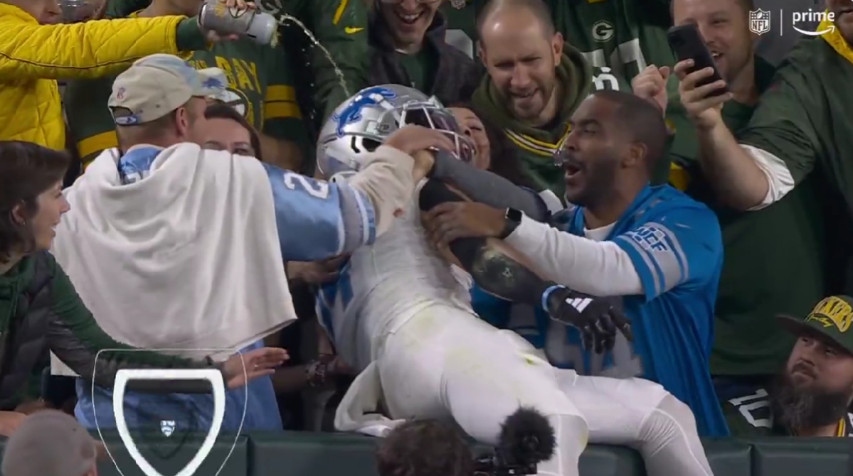 A classless Packers fan poured beer all over Amon-Ra St. Brown after he scored a TD