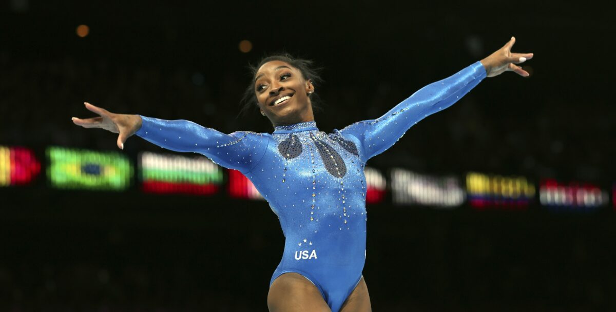 Simone Biles laughed off a tiny trip on her way to becoming the most decorated gymnast ever