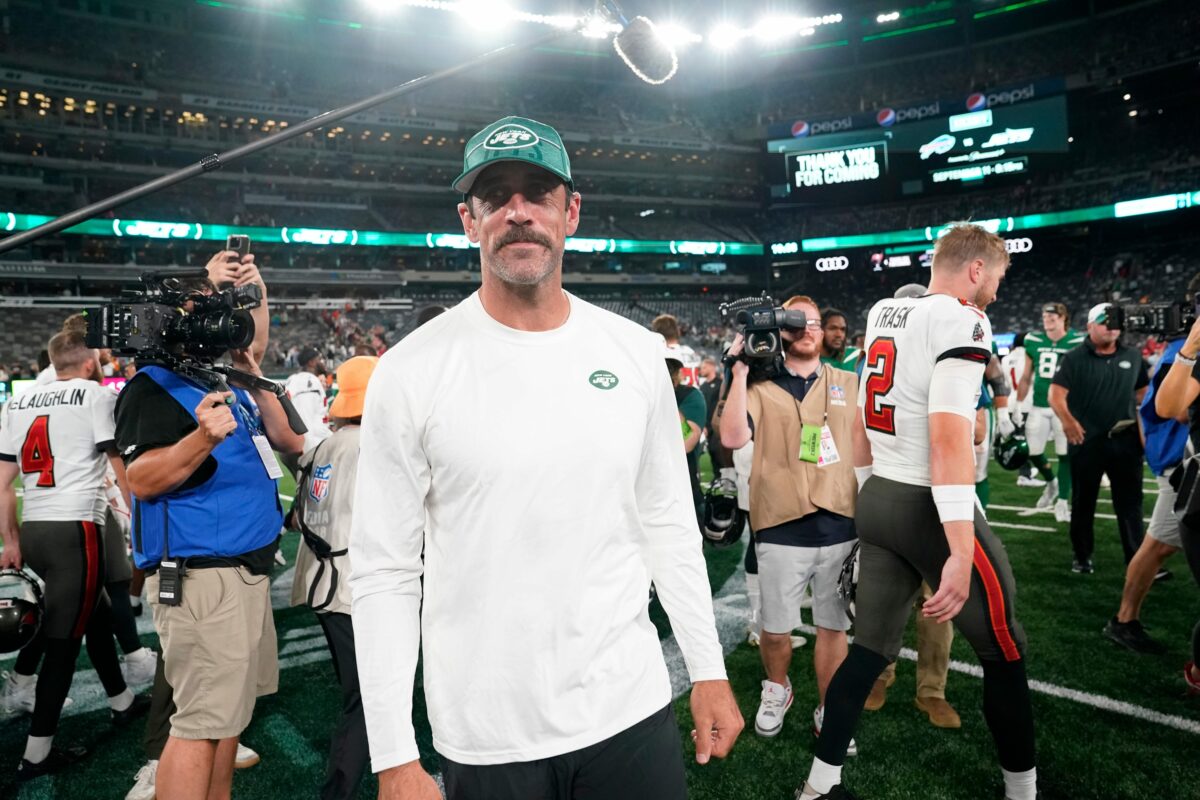 Aaron Rodgers on field at MetLife throwing passes