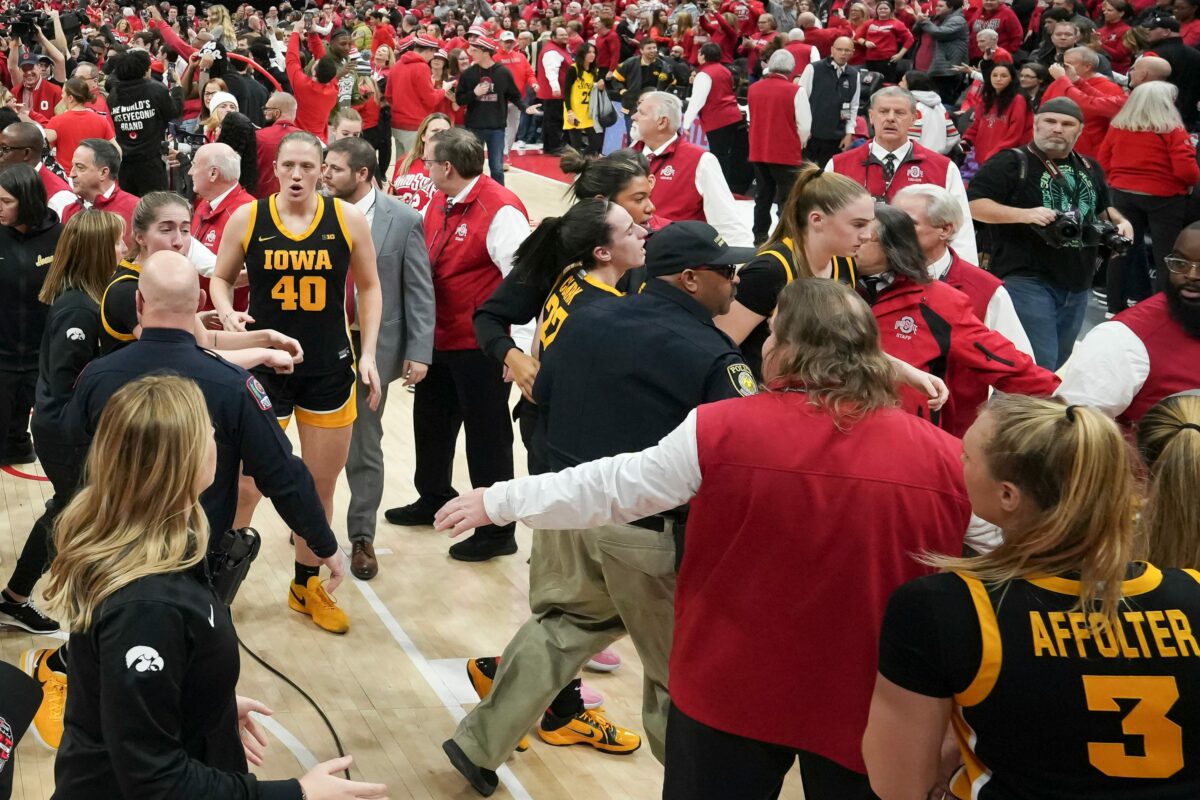 Caitlin Clark run over by fan storming the court after Ohio State upsets Iowa