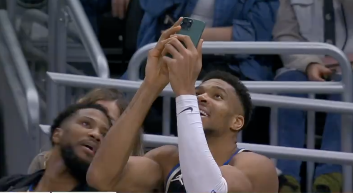 Giannis Antetokounmpo pulled out a phone on the Bucks bench to scan a QR code for free food