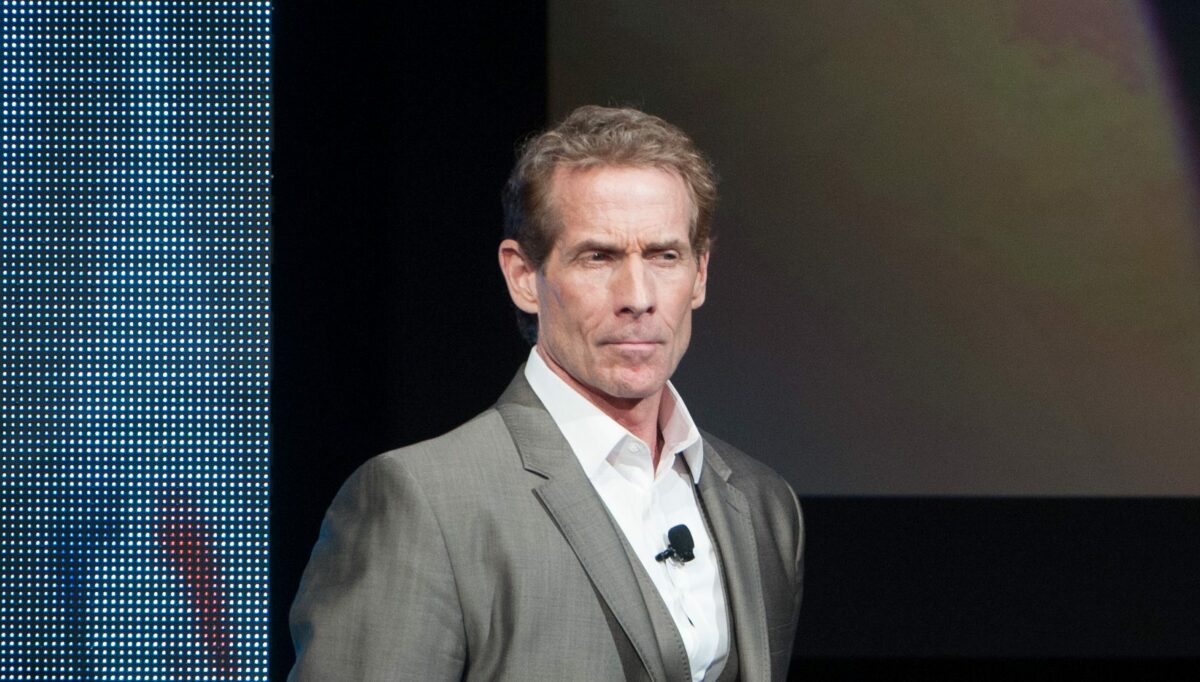 Skip Bayless gets trolled for struggling with his automatic trash can while tossing his Cowboys gear