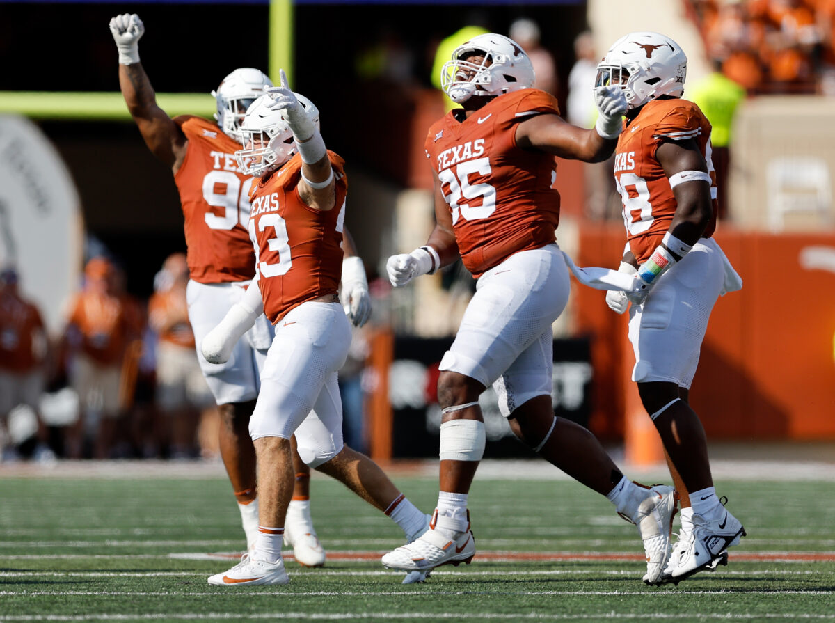 WATCH: Texas DT Alfred Collins scores on an Ethan Burke tipped pass