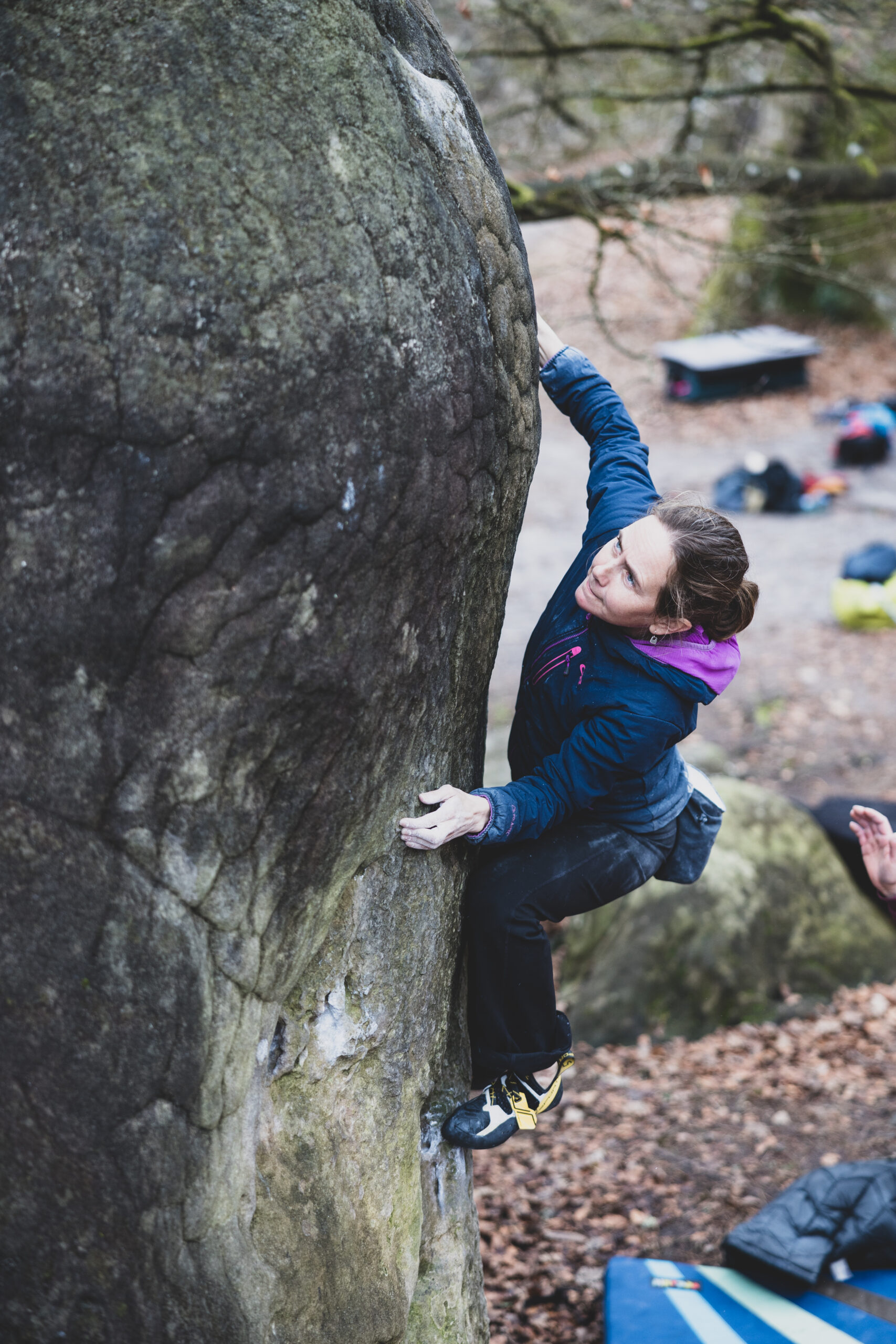 Climber Beth Rodden climbing a rock face.