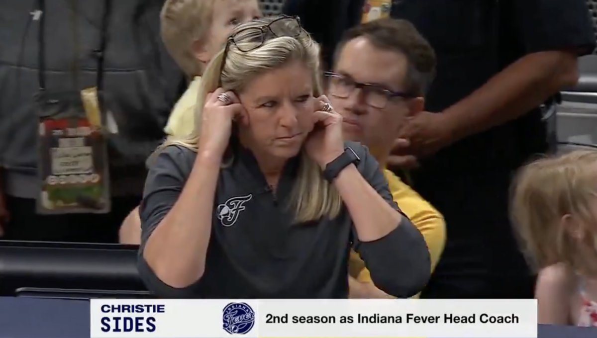 Fever coach Christie Sides looked so distracted by ESPN’s TV interview during a close fourth quarter