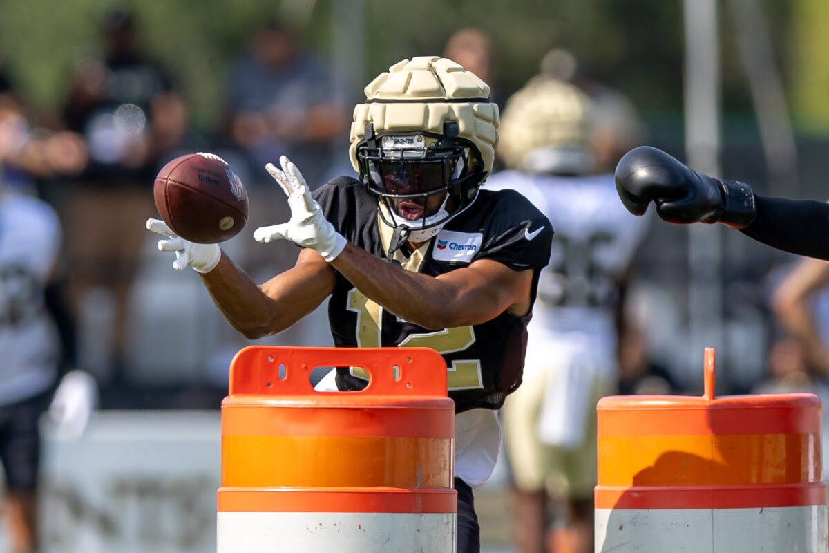 Chris Olave practicing with unique Guardian cap at Saints practice